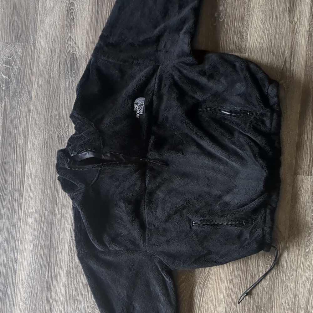 Black The North Face brand teddy/osito material.